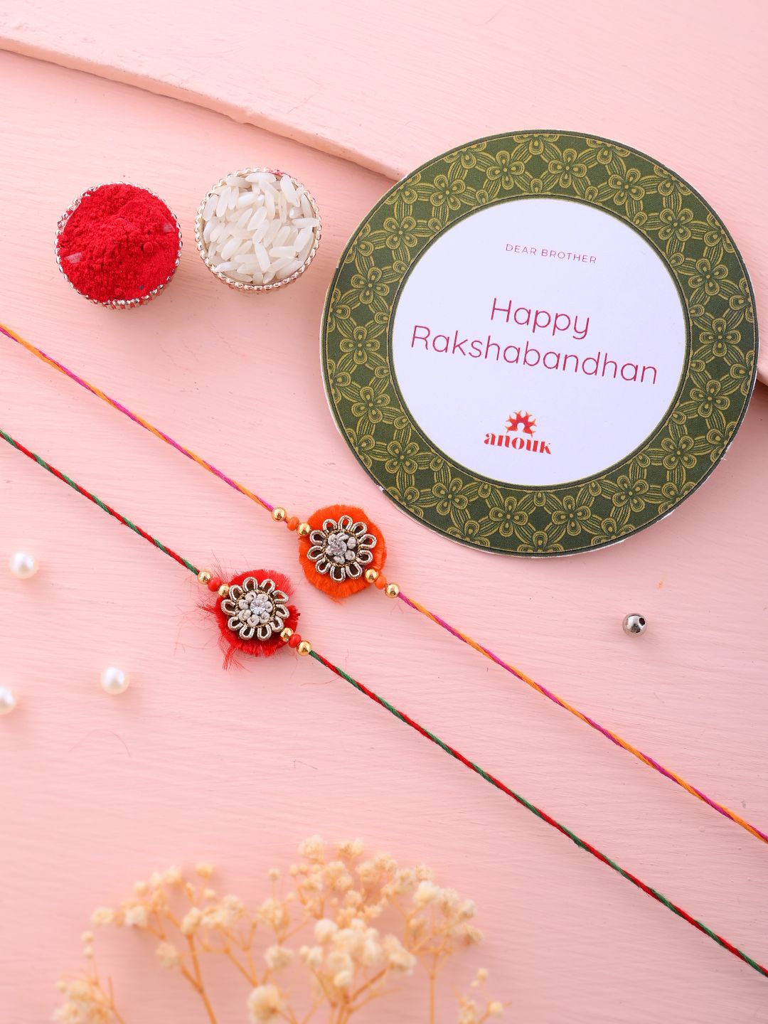 Anouk Set Of 2 Red Flower Design Stone Studded Rakhis Comes With Roli Rice & Greeting Card