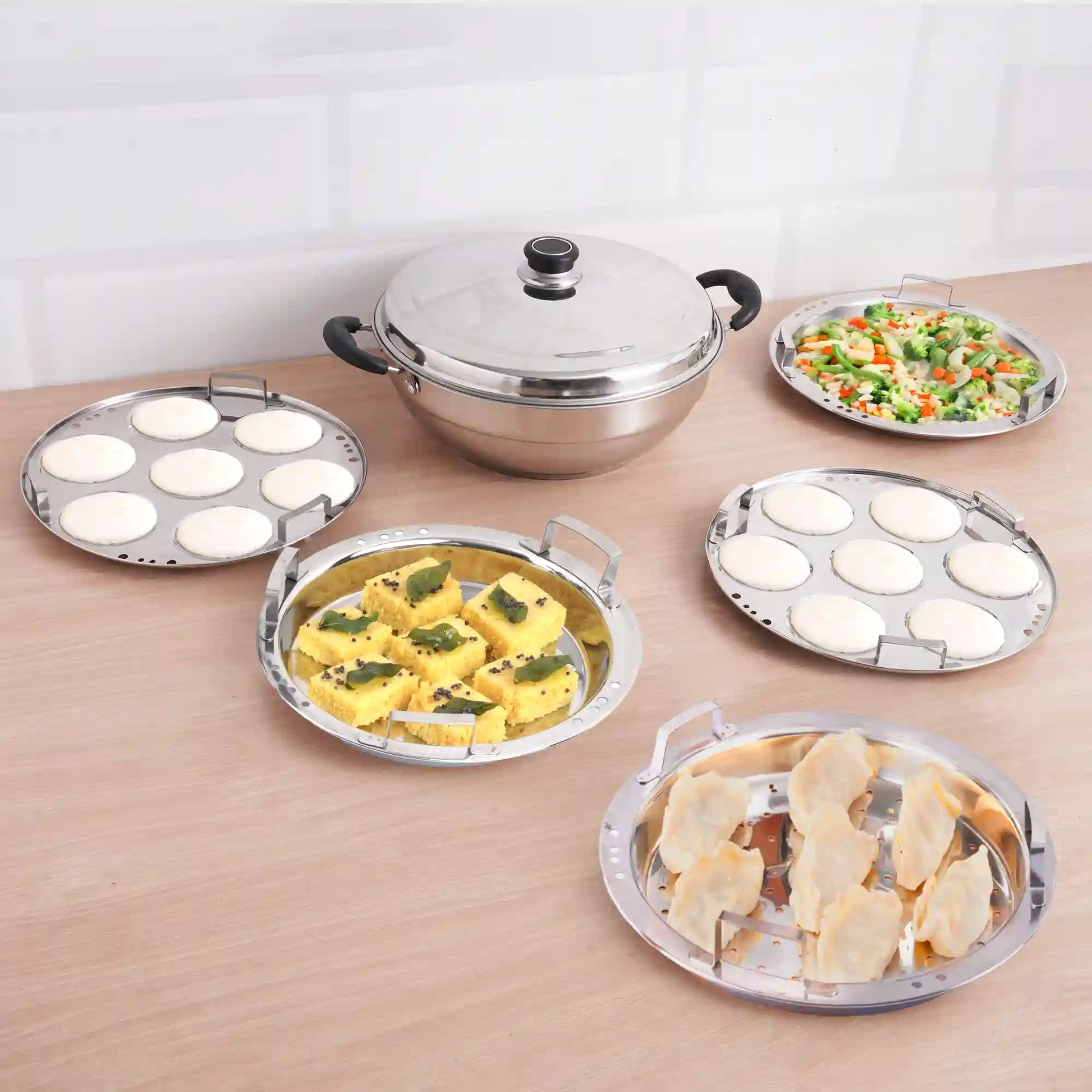 The Indus Valley 14-pit tri-steel multi-pot handi with stainless steel plates for steaming idli, dhokla, and momos, 4.2L capacity.