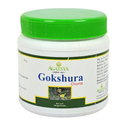 Agatsya Gokshura Churna in a glass bowl, showing the fine powdered herbal supplement from the Agatsya brand.