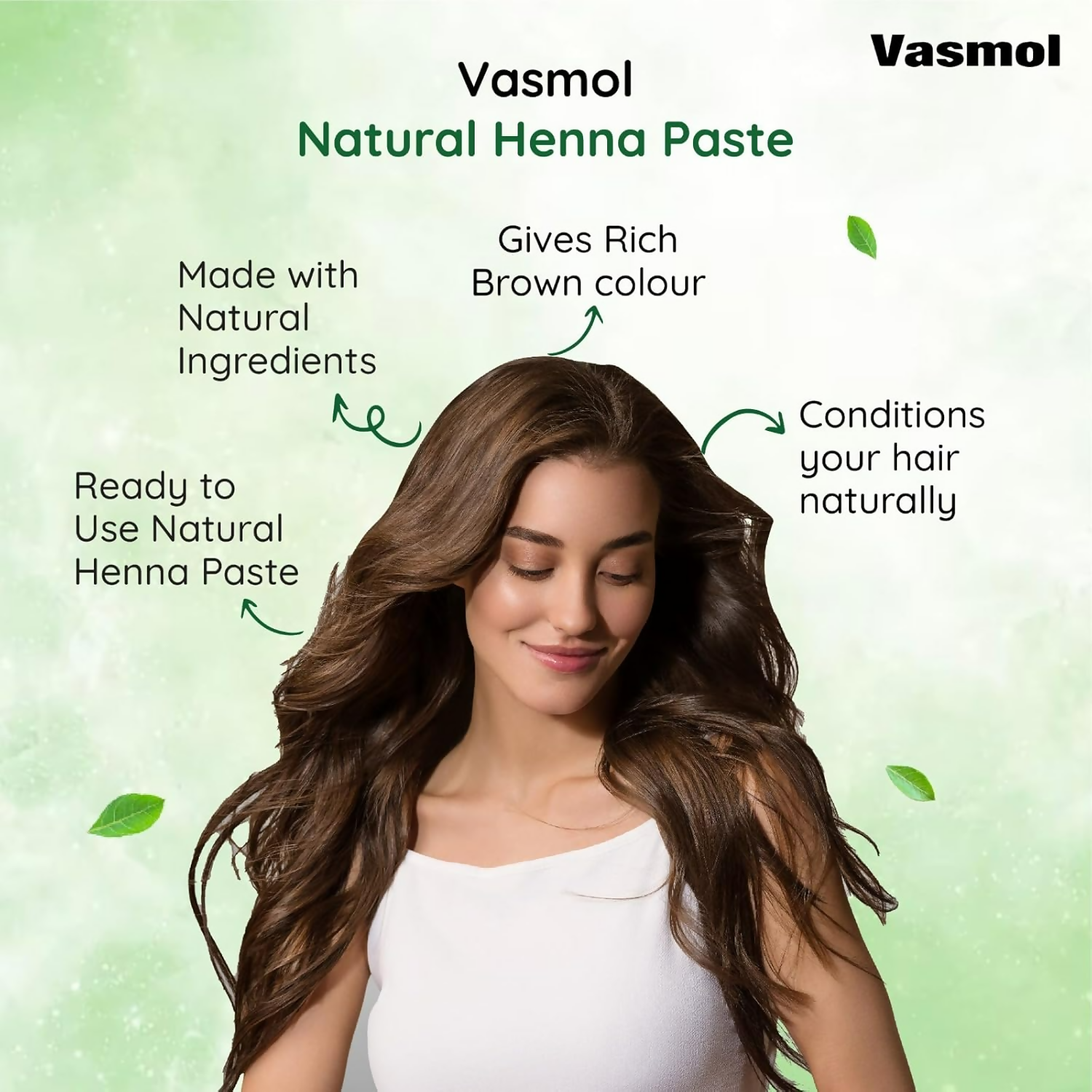 Vasmol Natural Henna Paste ready-to-use for hair coloring, showcasing a bowl of vibrant green henna paste with fresh leaves beside it.