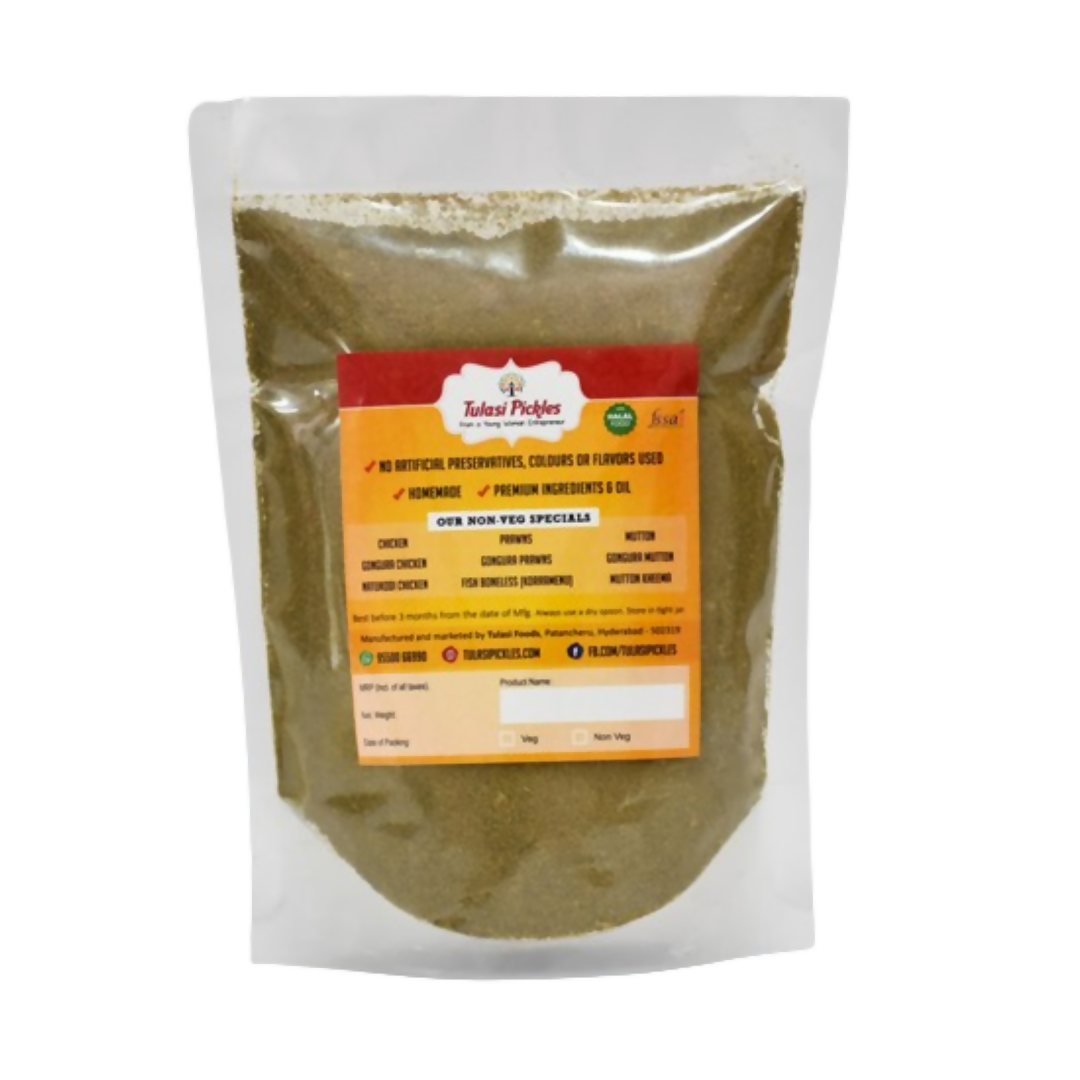 Spice jar of Tulasi Pickles Karivepaku Podi chutney powder in a clear container with a spoon, ready for serving or cooking.