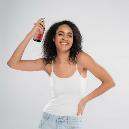 Ivory Natural hair spray for long hair, showing a woman with shiny, healthy long hair, emphasizing hair growth and strength.