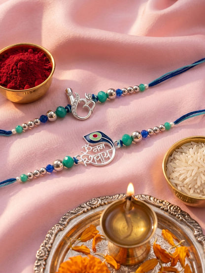 Anouk Set Of 2 Silver Toned Beaded Religious Thread Rakhi With Roli Chawal Chandan Mishri
