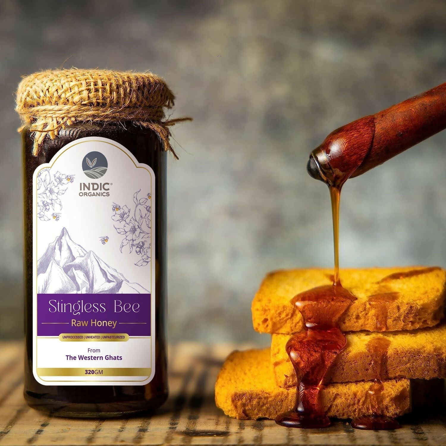 Small jar of Indic Organics stingless bee raw honey from Western Ghats, used as a natural spread or condiment.