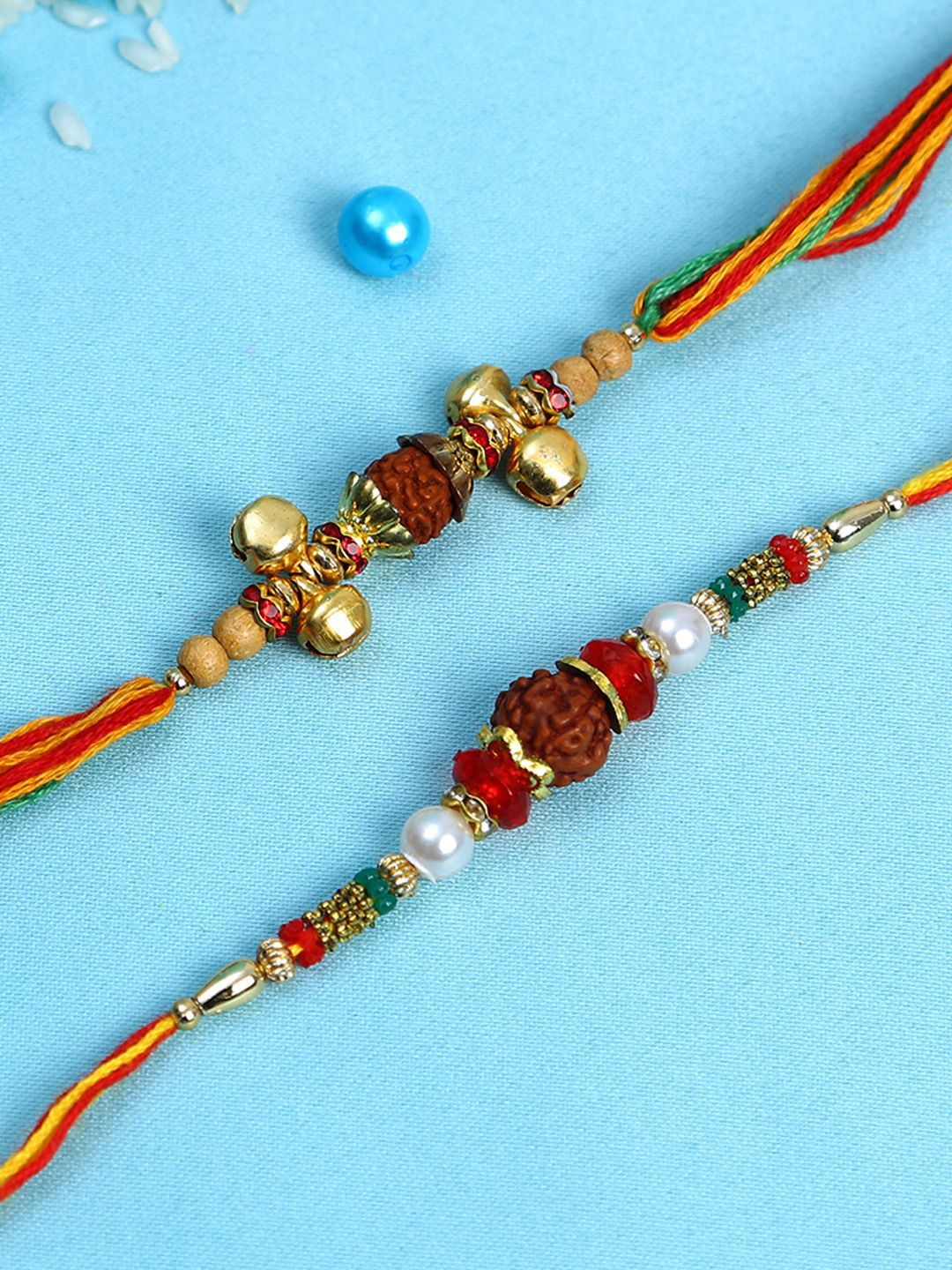 Anouk Set Of 2 Small Bells & Rudaraksh Rakhi Comes With Roli Rice & Greeting Card
