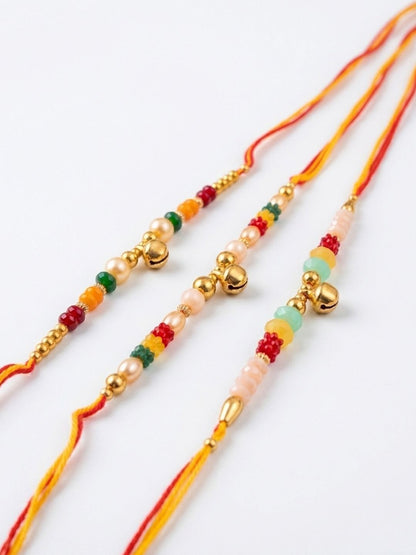 Anouk Set Of 3 Artificial Beads Orange Thread Rakhi With Roli Chawal Chandan Mishri