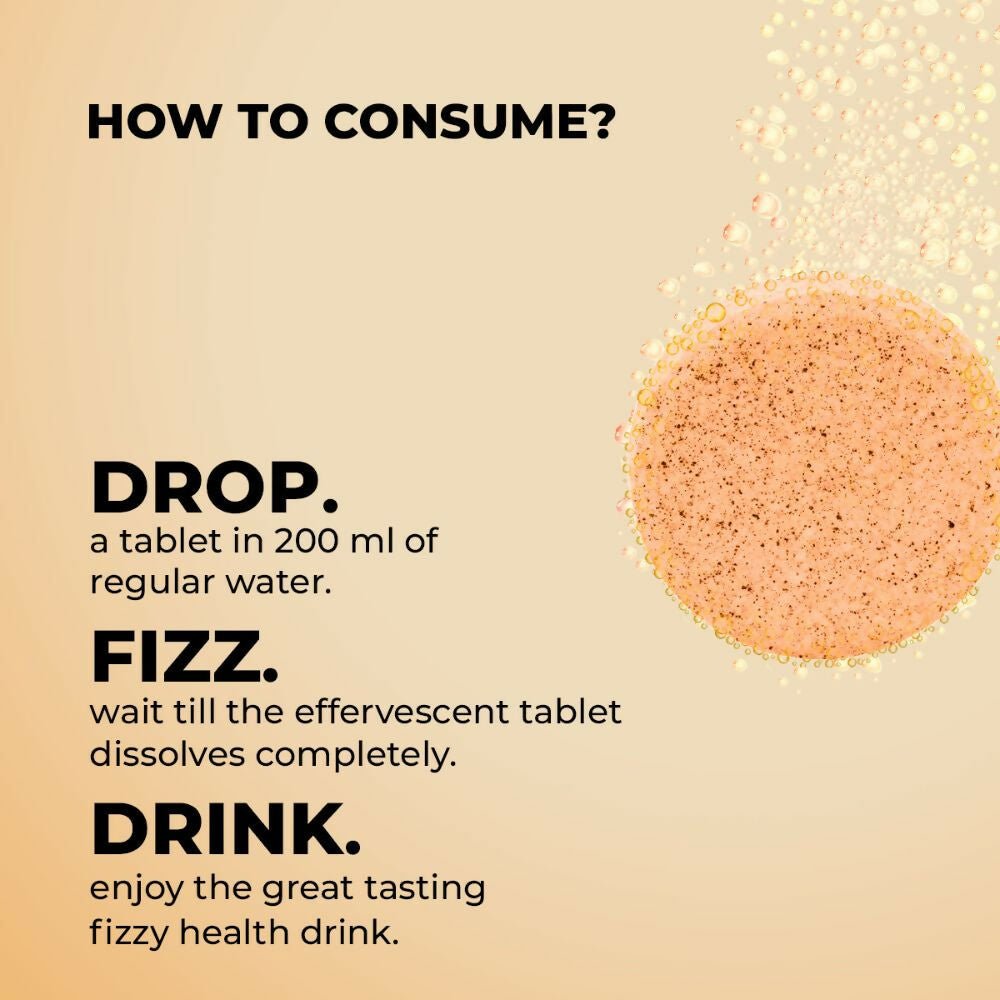 Auric Ayurvedic Lung Detox Effervescent Tablets in a glass of water, showing the dissolving tablets and fresh lemon slices.