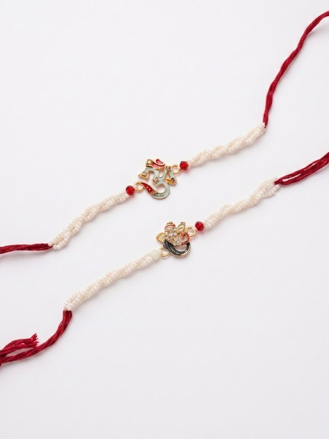 Anouk Set Of 2 White Pearls Om & Ganesh Ji Thread Rakhi With Roli Chawal Chandan Mishri