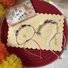 Dhiyona Set Of 2 Artificial Beads Thread Rakhi With Roli Chawal Chandan Mishri