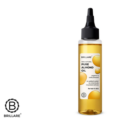 Bottle of Brillare 100% natural pure almond oil for hair, showing clear liquid and almond oil label on the container.