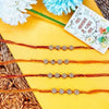 Dhiyona Set Of 4 Artificial Stones Floral Design Thread Rakhi
