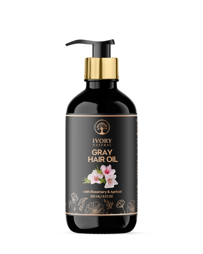 Ivory Natural Gray Oil Restore hair oil in a clear bottle, showing the light-colored liquid for natural black hair shine and restoration.