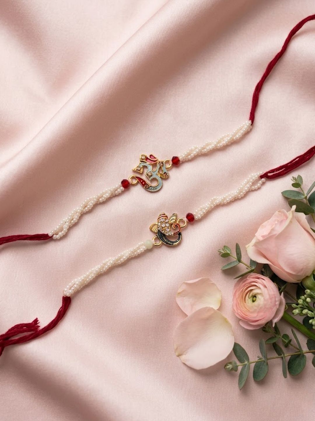 Anouk Set Of 2 White Pearls Om & Ganesh Ji Thread Rakhi With Roli Chawal Chandan Mishri