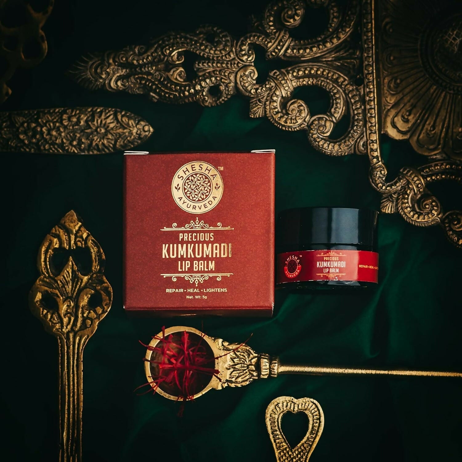 Shesha Ayurveda Kumkumadi Brightening Lip Balm in a small jar, with a smooth, glossy appearance and natural packaging.
