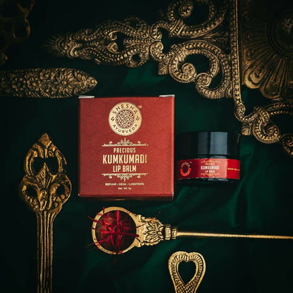 Shesha Ayurveda Kumkumadi Brightening Lip Balm in a small jar, with a smooth, glossy appearance and natural packaging.