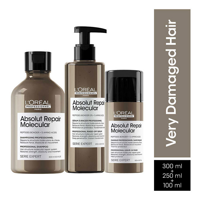 L'Oreal Paris Absolut Repair hair masks, including shampoo, rinse-off serum, and leave-in mask for damaged hair, in a display setup.