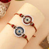 Dhiyona Set Of 2 White Pearl-Beaded Rakhi With Roli Rice & Greeting Card