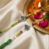 Dhiyona Set Of 2 Multicolor Religious Thread Rakhi With Roli Chawal Chandan Mishri