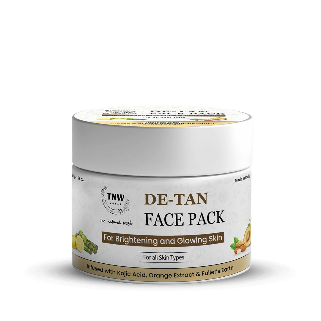 The Natural Wash De-Tan Face Pack for glowing skin, displayed in a bowl with herbal ingredients and a wooden spatula.