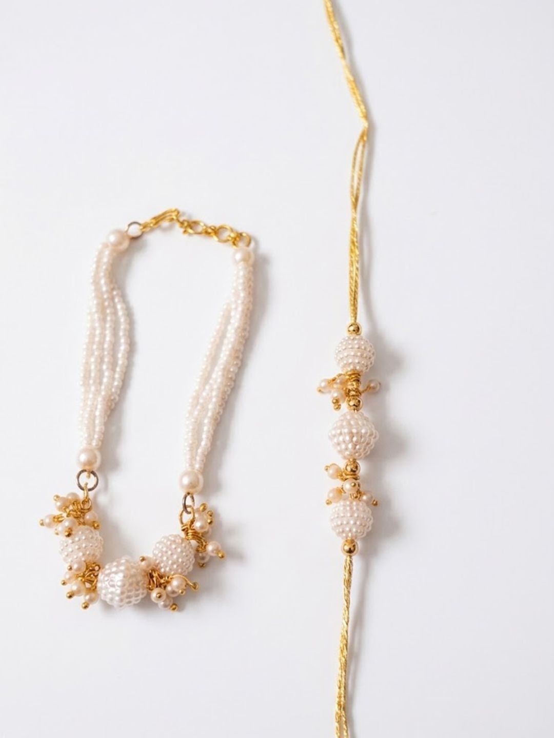 Anouk Set Of 2 Gold Toned & White Pearls Bhaiya Bhabhi Rakhi