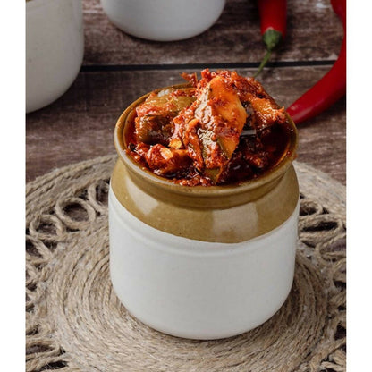 G Pulla Reddy Mango Pickle Without Garlic, North Indian style, in a glass jar with vibrant mango pieces and spicy pickle mixture.