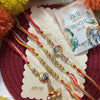 Dhiyona Set Of 4 Artificial Beads Family Pack Thread Rakhi With Roli Chawal Chandan Mishri