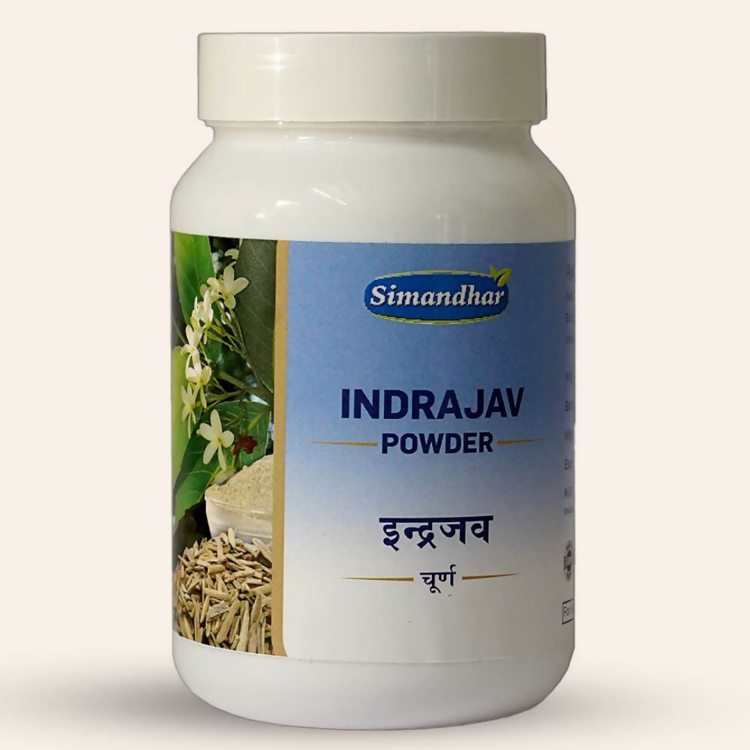 Simandhar Indrajav Ayurvedic Churna powder in a glass jar with a wooden spoon, showcasing traditional herbal supplement.