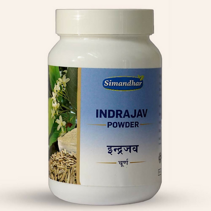 Simandhar Indrajav Ayurvedic Churna powder in a glass jar with a wooden spoon, showcasing traditional herbal supplement.