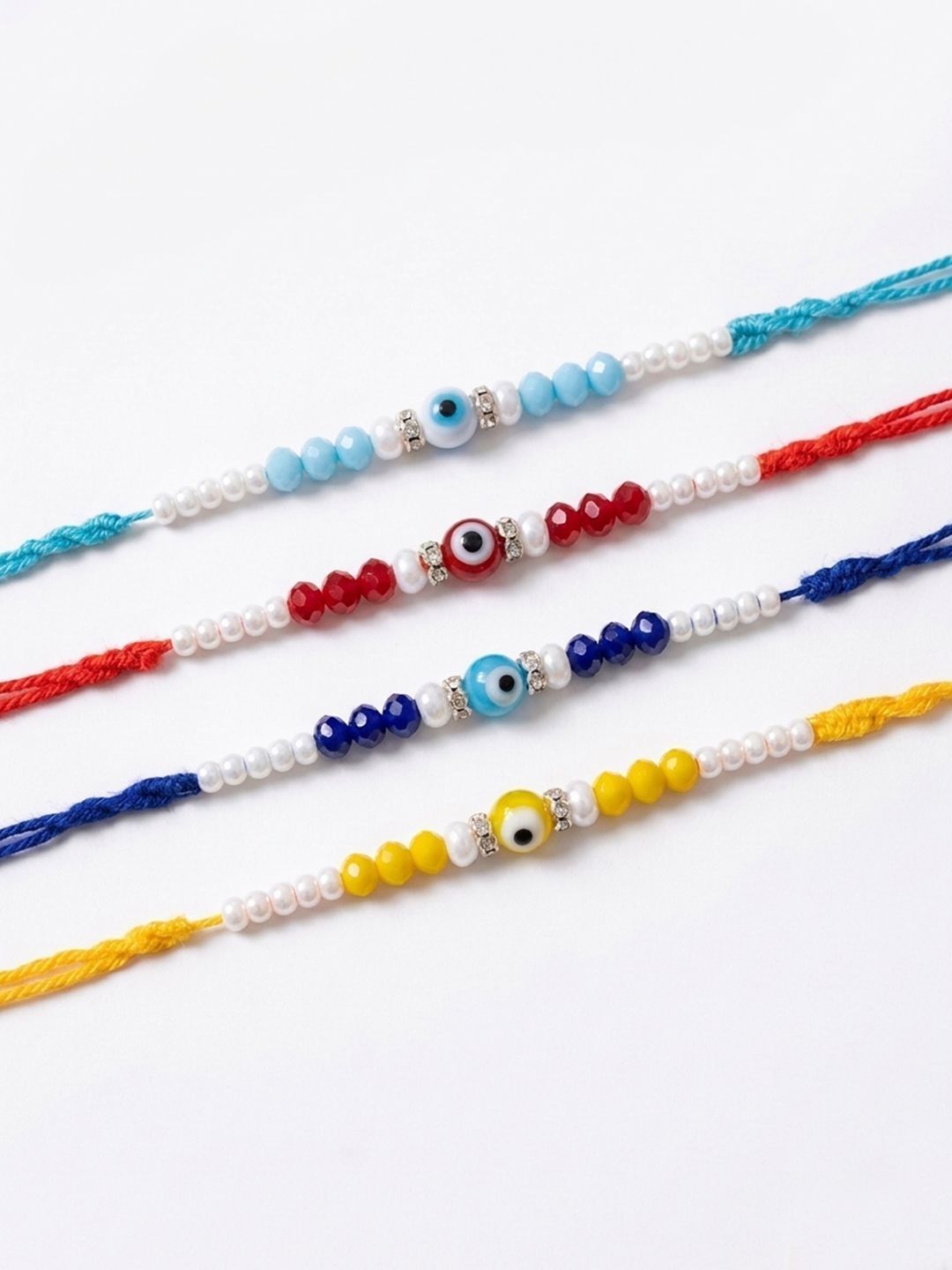 Anouk Set Of 4 Multicolor Evil Eye Thread Rakhi With Roli Chawal Chandan Mishri