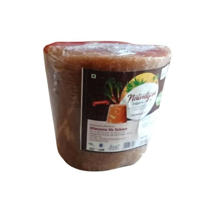 Naivedyam chemical-free jaggery cubes showing golden brown, textured sugar blocks ideal for natural sweetening.
