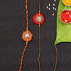 Dhiyona Set Of 2 Red Flower Design Stone Studded Rakhis Comes With Roli Rice & Greeting Card