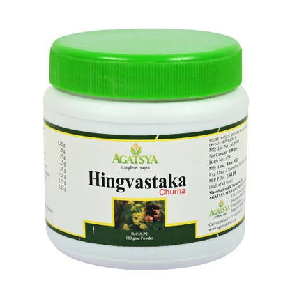 Agatsya Hingvastaka Churna in a glass jar, traditional Ayurvedic herbal powder for digestive health.