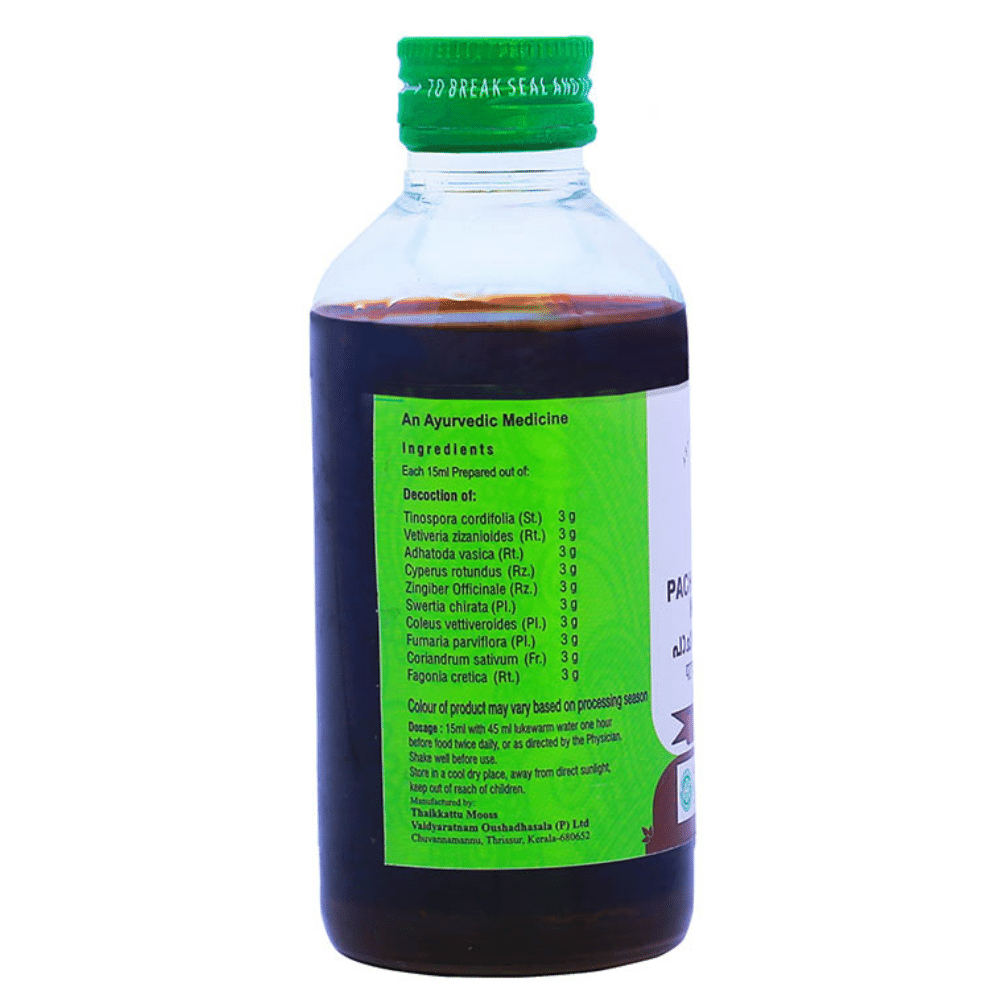 Vaidyaratnam Pachanamrutham Kashayam Ayurvedic syrup with vetiver for wellness, displayed in a glass bottle on a wooden surface.