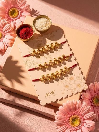 Anouk Set Of 3 Gold Toned Ghungroo & Red Thread Rakhi With Roli Chawal Chandan Mishri
