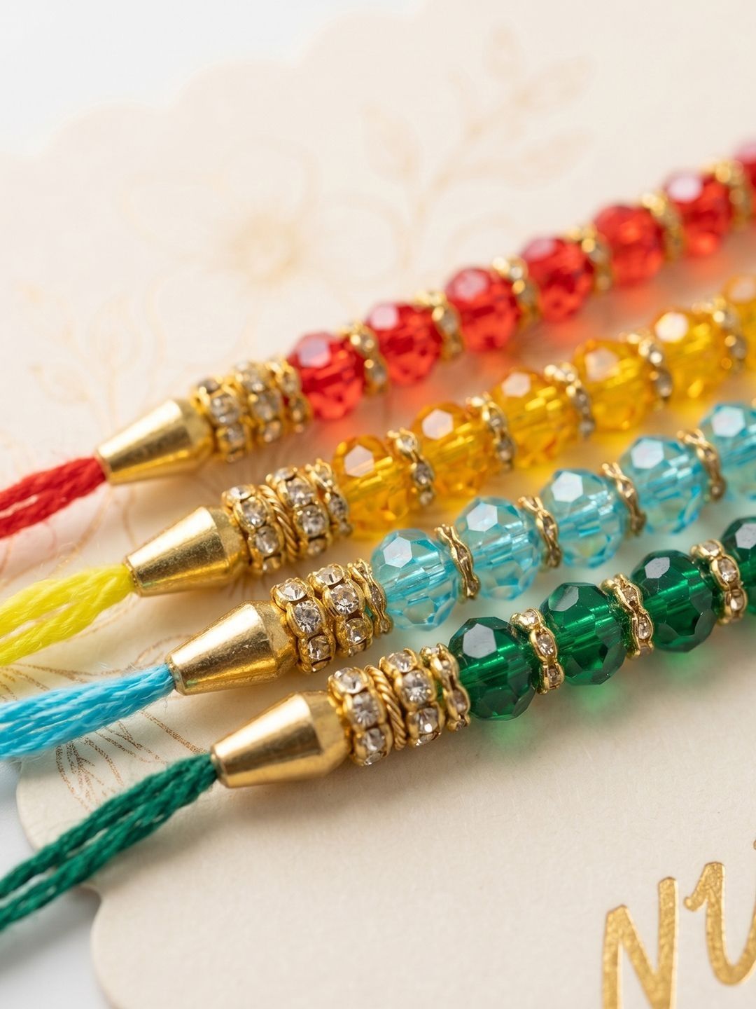 Anouk Set Of 4 Multicolor Artificial Beads Thread Rakhi With Roli Chawal Chandan Mishri