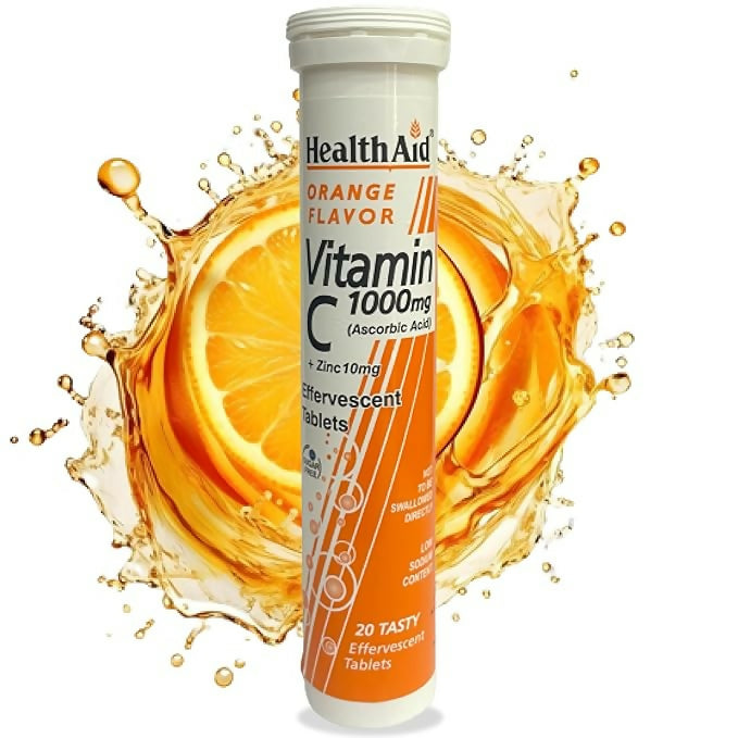 HealthAid Vitamin C 1000mg orange-flavored effervescent tablets with zinc, Ayurvedic supplement in a glass of dissolved tablets.