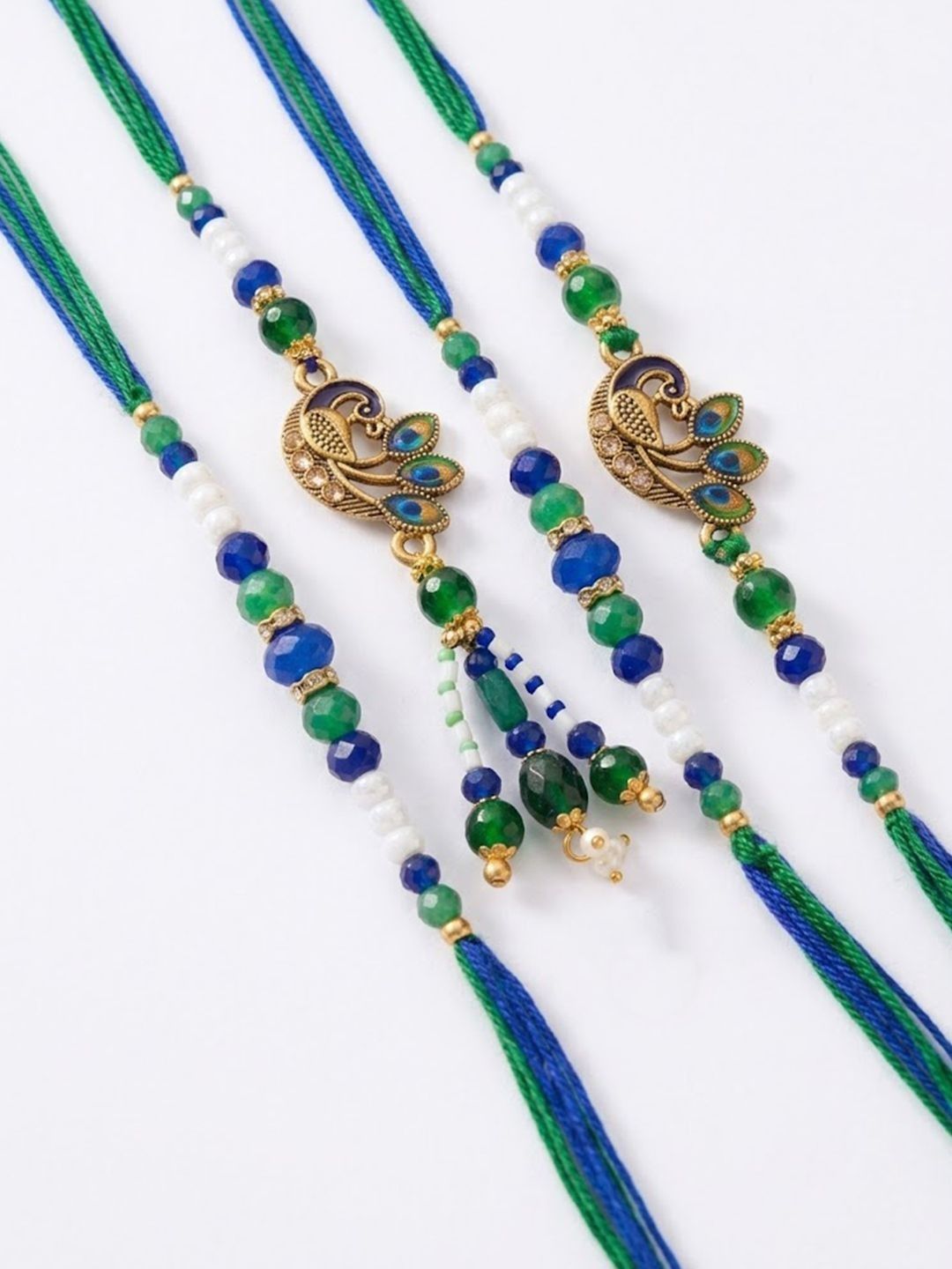Anouk Set Of 4 Green Peacock Design Artificial Beads Thread Rakhi With Roli Chawal