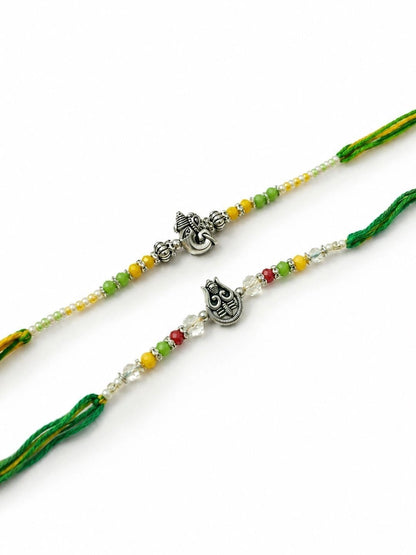 Anouk Set Of 2 Multicolor Religious Thread Rakhi With Roli Chawal Chandan Mishri