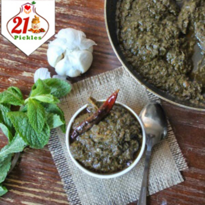 Spicy North Indian Gongura pickle from 21Pickles with fresh green leaves and rich, tangy flavor in a glass jar.