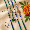 Dhiyona Set Of 4 Green Peacock Design Artificial Beads Thread Rakhi With Roli Chawal