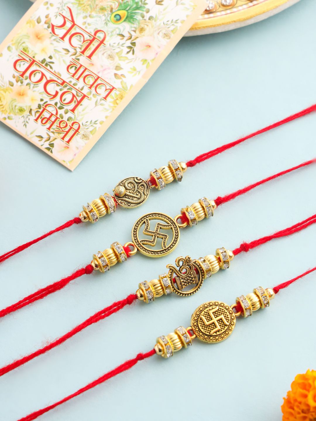 Anouk Set Of 2 Stones Studded Swastik Design Thread Rakhis & Roli Chawal Chandan