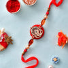 Dhiyona Red Resin-Based Ganesha Rakhi With Roli Chawal & Greeting Card