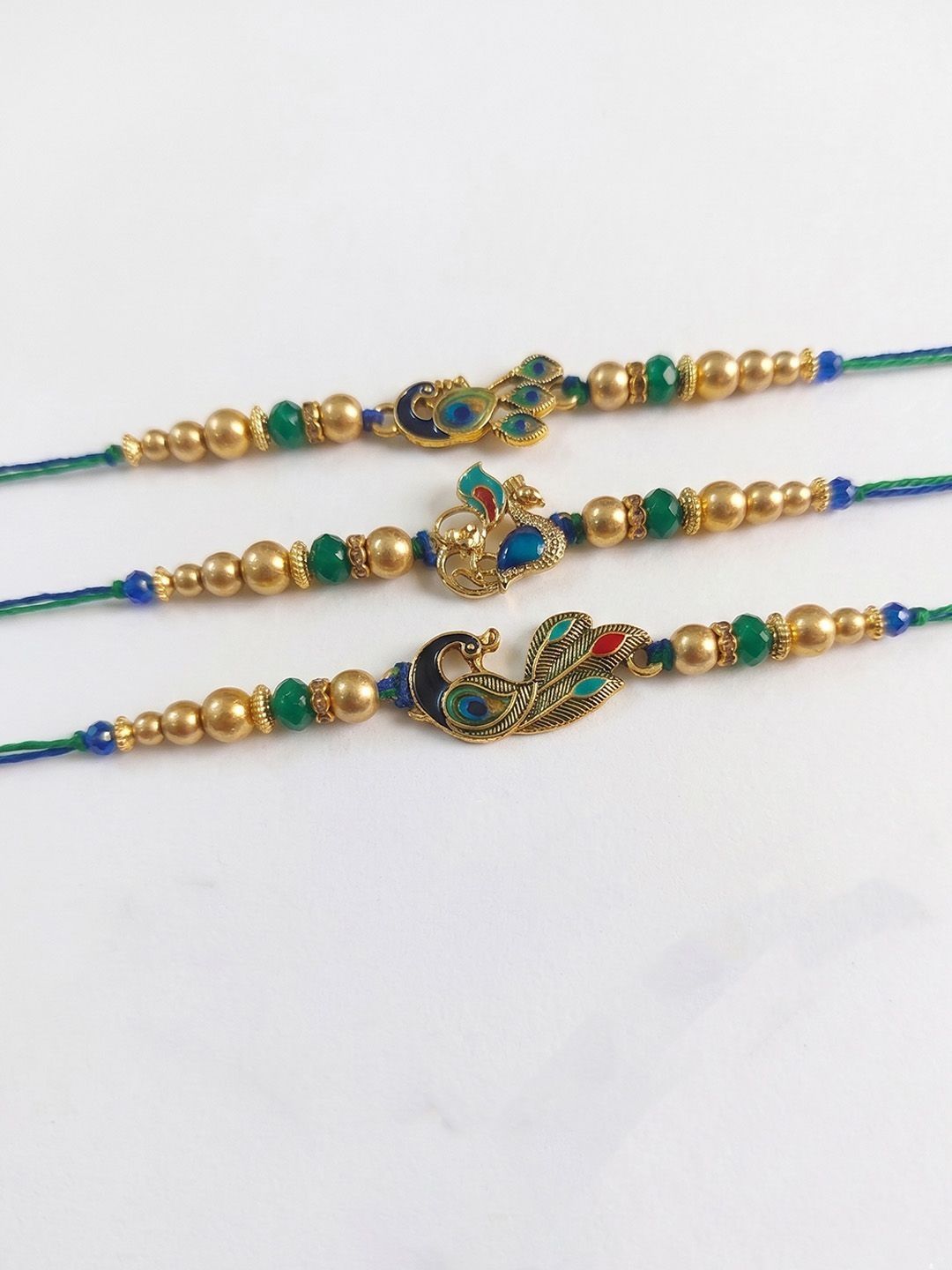 Anouk Set Of 3 Peacock Design Multicolor Artificial Beads Thread Rakhi With Roli Chawal