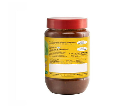 North Indian Tasty Nibbles Kaduku Mango Pickle in a jar, showing vibrant orange mango chunks and spices.