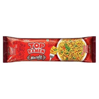 A bowl of Nissin Top Ramen Masala instant noodles with spices and toppings, served in a white bowl on a wooden table.
