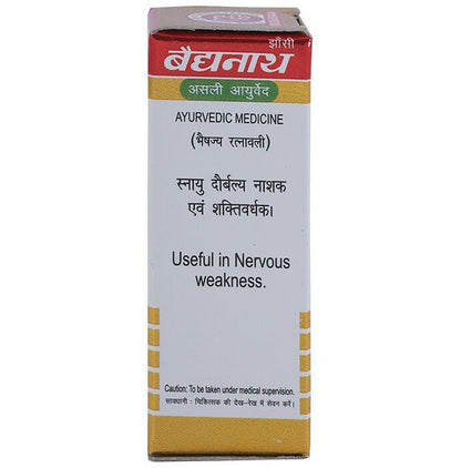Baidyanath Jhansi Shakra Wallabha Ras Ayurvedic supplement with gold powder in a glass container, traditional herbal medicine.