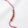 Dhiyona Religious Rudraksh Thread Rakhi With Roli Chawal Chandan Mishri