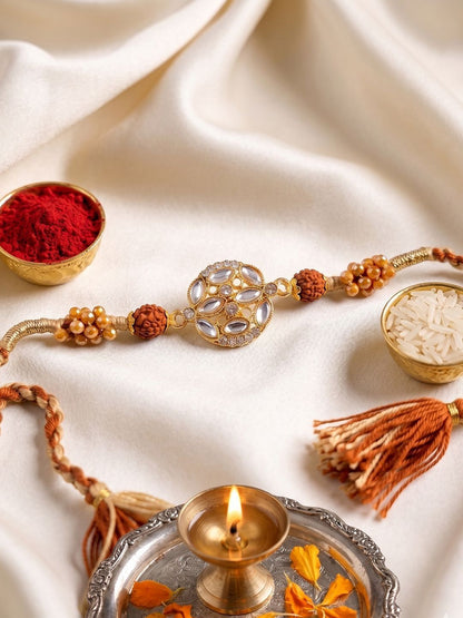 Anouk Rudraksh & Kundan Studded Gold Toned Thread Rakhi With Roli Chawal Chandan Mishri