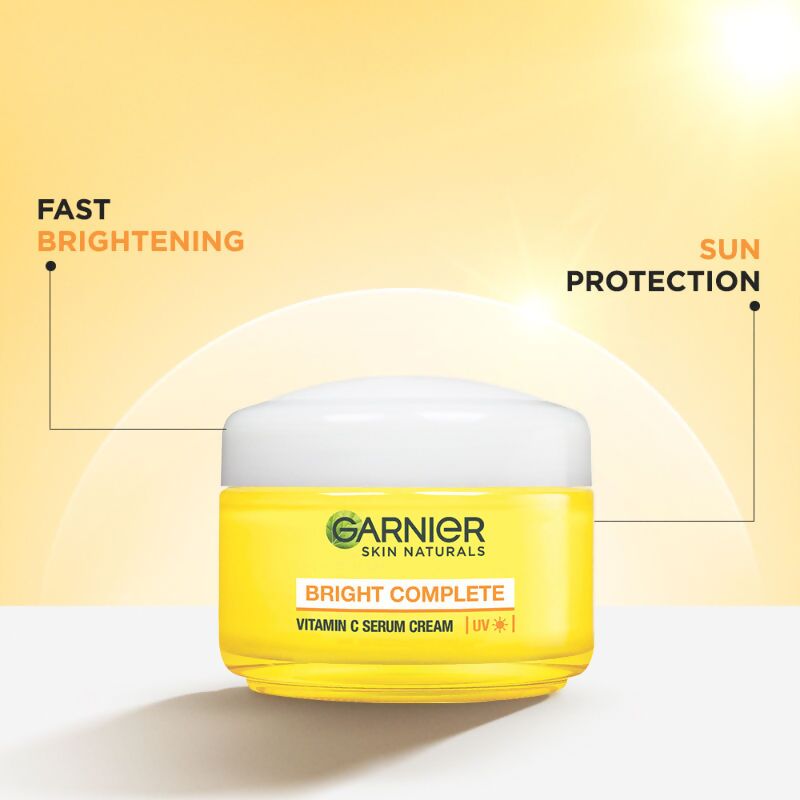 Garnier Skin Naturals Bright Complete Vitamin C serum cream in a jar, featuring orange and white packaging, for radiant skin.