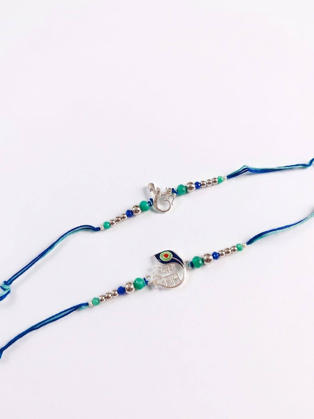 Anouk Set Of 2 Silver Toned Beaded Religious Thread Rakhi With Roli Chawal Chandan Mishri